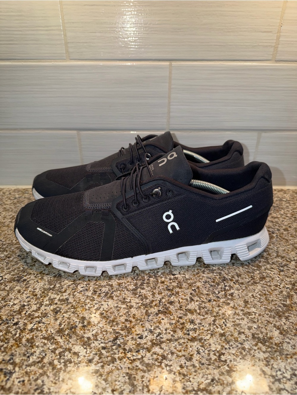 On Running Men’s Athletic Shoes in Black and White